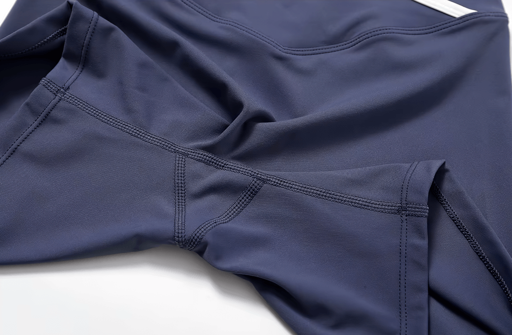 Close-up of navy high-waist flared yoga pants for women, featuring a stylish seam design and soft, stretchy fabric for ultimate comfort.